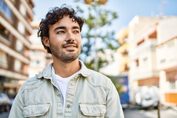 Sticker - Handsome hispanic man with beard smiling happy outdoors on a sunny day