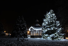 Old Pavilion In Christmas Time Covered In Snow And Near The Christmas Tree In The Middle Of The Night In The Karlova Studánka Spa. Night Time Full Of Christmas Atmosphere.