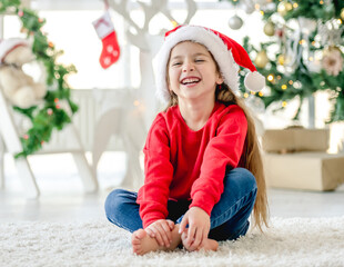 Wall Mural - Child girl in Christmas time