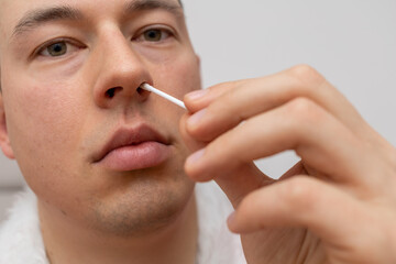 young man taking self-test for covid 19 prevention