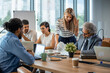 © Dragana Gordic - Group of people are working together in a modern working space. Cropped shot of a group of colleagues having a discussion in a modern office. Team of professionals having a new project meeting