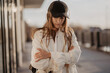 © kalinichenkod - Summer sunny lifestyle fashionable portrait of young stylish woman hipster walking down the street wearing cute trendy outfit