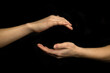© FellowNeko - Hand sphere or circle gesture isolated on a black background
