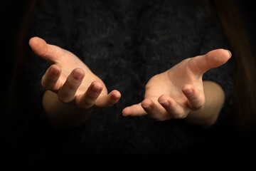 praying gesture with hands on a black background photo