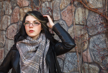 Wall Mural - portrait of young girl near the old stone wall