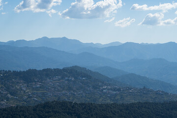  view of almora city from kesar devi on a bright sunny day