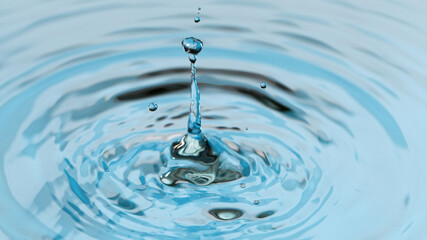 Wall Mural - Water splash isolated on light blue background, nacro shot.