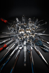 Auto mechanic tools on dark background