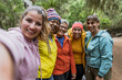© Alessandro Biascioli - Group of women with different ages and ethnicities having fun taking selfie while walking in the woods - Adventure and travel people concept
