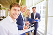 © Robert Kneschke - Business man as a start-up entrepreneur with team