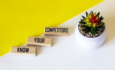 Wall Mural - there is a conceptual image on the wooden blocks. text know that your competitors are doing well in 