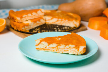 Wall Mural - pumpkin casseroles with zebra-shaped cottage cheese, autumn orange pie. cut the pie into pieces on a plate .