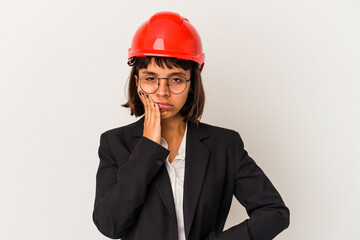 Wall Mural - Young architect woman with red helmet isolated on white background who is bored, fatigued and need a relax day.