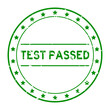 Grunge green test passed word round rubber seal stamp on white background