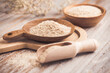 Isabgol - heap of psyllium husk in wooden bowl on wooden table table
