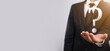 © Ivan - Businessman man hand hold interface question marks sign web. Ask quiestion online, FAQ concept, what where when how and why, search information on internet