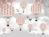 soft pink balloons on a light grey background of the sky