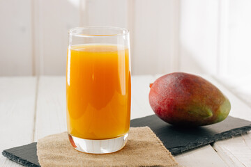 Canvas Print - Mango juice in a glass, fresh fruit drink