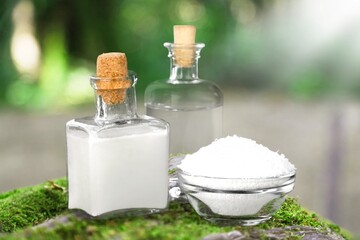 Poster - Medicine bottle on moss. Nature background provides, cosmetic concept