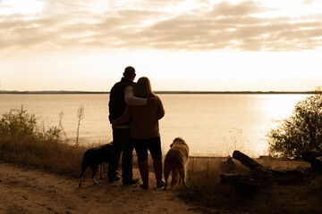 Family with their pets looking at the water beach sand nature sky clouds beauty beautiful together 4 fun 4 legs