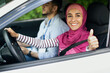 Happy Muslim Woman Showing Thumb Up After Successful Exam In Driving School