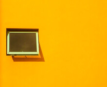 Yellow Window On A Wall