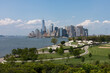 Lower Manhattan Skyline view and Luxury Camping Tents on Governors Island in New York City during the Summer