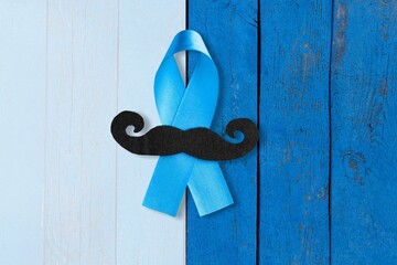 Wall Mural - November Prostate Cancer Awareness month. Blue Ribbon with a mustache. Healthcare