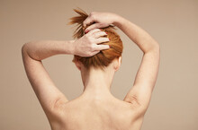 Minimal Back View Of Young Red Haired Woman With Nude Shoulders, Copy Space
