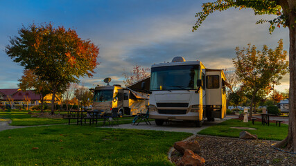 Wall Mural - Beautiful sunset in autumn at the Rv campsite with clouds and blue skies
