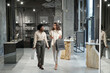 © pressmaster - Young intercultural females in elegant casualwear moving along jewelry store or boutique whileshopping in mall on black friday