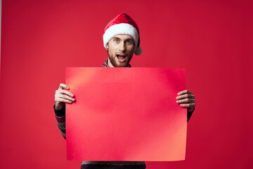 Wall Mural - handsome man in a christmas red mockup poster isolated background