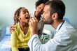 © NDABCREATIVITY - Young male pediatrician doctor examining child at office. Healthcare prevention exam people concept