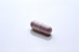 Fototapeta  - close up of medical capsules on white background
