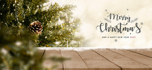 empty christmas table background with christmas tree out of focus for product display montage.