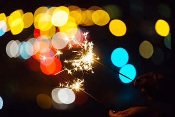 Poster - holiday sparkler on the black background