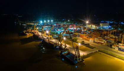 Container ship in export and import business and logistics. at Cambodia . Water transport International. Aerial view