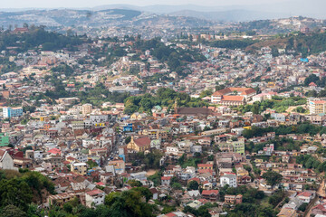 an aerial view of antananarivo, madagascar, revealing the city’s dense urban sprawl and complex layo