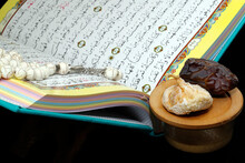 Holy Quran Book With Prayer Beads And Date, Ramadan Concept, Muslim Faith And Religion, France