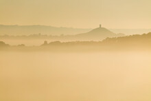 Glastonbury Tor And Surrounding Hills Rising Above Early Morning Mist, Glastonbury, Somerset