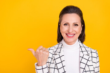 Poster - Portrait of attractive positive person direct thumb empty space offer proposition isolated on yellow color background