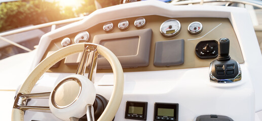 Steering wheel on luxury yacht cabin