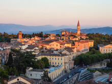 View Of Perugia's Cityscape From Giardini Carducci Viewpoint At Sunset, With St. Pietro's Abbey, Perugia, Umbria, Italy