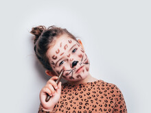 Girl In Cheetah Costume Painting Face