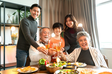 asian multi generation grandparent grandchild happiness joyful dinner together at home,holidays, cel