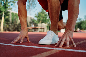 Muscled athletic men on the sports ground workout exercises