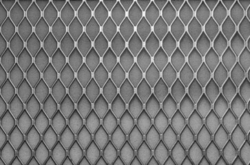 Metal grid with geometric pattern of rhombi, background. Black metallic modern background