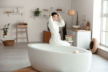 Sticker - Relaxed young woman in bathrobe after taking bath at home