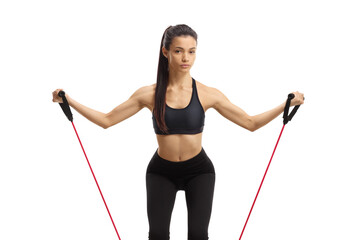 Wall Mural - Young female exercising with a resistance band