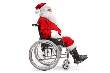 Poster - Full length profile shot of a santa claus sitting in a wheelchair